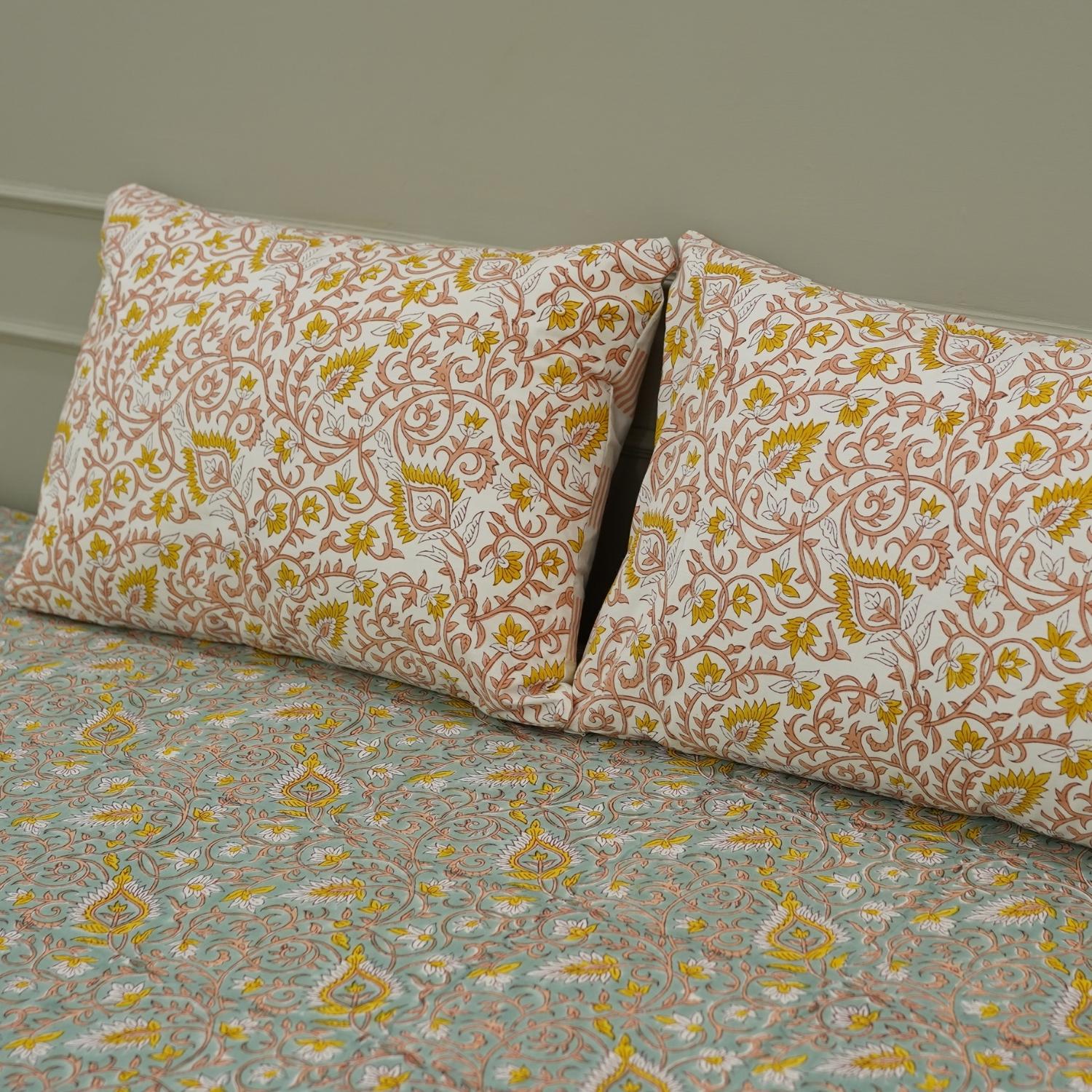 Each motif on this cotton bedsheet is hand block printed using wooden blocks, ensuring every set is one-of-a-kind. Its floral patterns and soft touch make it ideal for dreamy, earthy interiors.