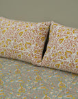 Each motif on this cotton bedsheet is hand block printed using wooden blocks, ensuring every set is one-of-a-kind. Its floral patterns and soft touch make it ideal for dreamy, earthy interiors.