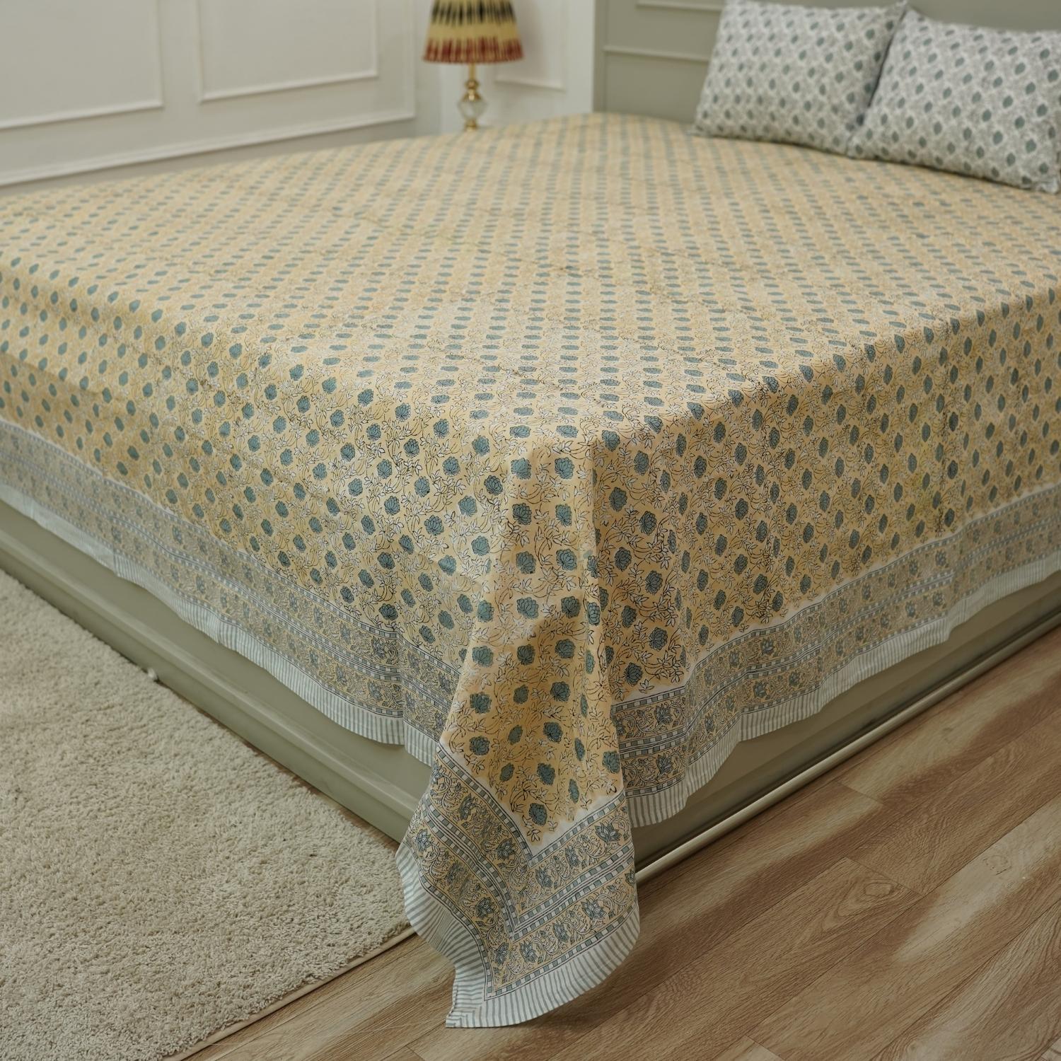 Embrace rustic charm with our block printed cotton bed linen. The floral patterns, hand-stamped using wooden blocks, celebrate Indian craftsmanship. This breathable cotton bedsheet and matching pillow cover add a soulful, artisanal touch to your home.