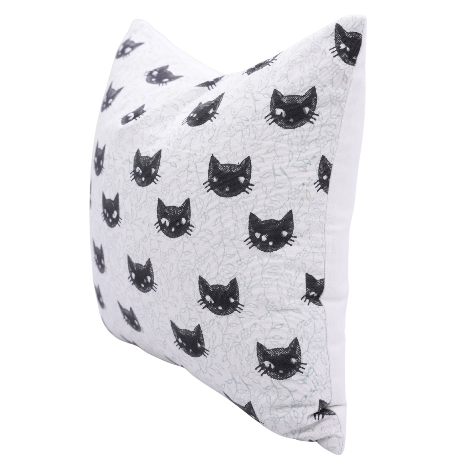 Quilted pillow with black cat pattern on a white background