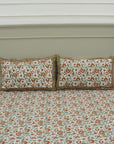 Elevate your space with bohemian elegance through this hand block printed cotton bedsheet set. Designed with intricate floral motifs and paired with pillow covers, this bedding brings handcrafted warmth and natural beauty into your room.
