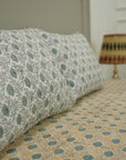 This hand block printed cotton bedsheet and pillow set is a statement in sustainable living. Natural dyes and floral designs create a calming aesthetic, offering handmade luxury with a touch of earthy elegance.