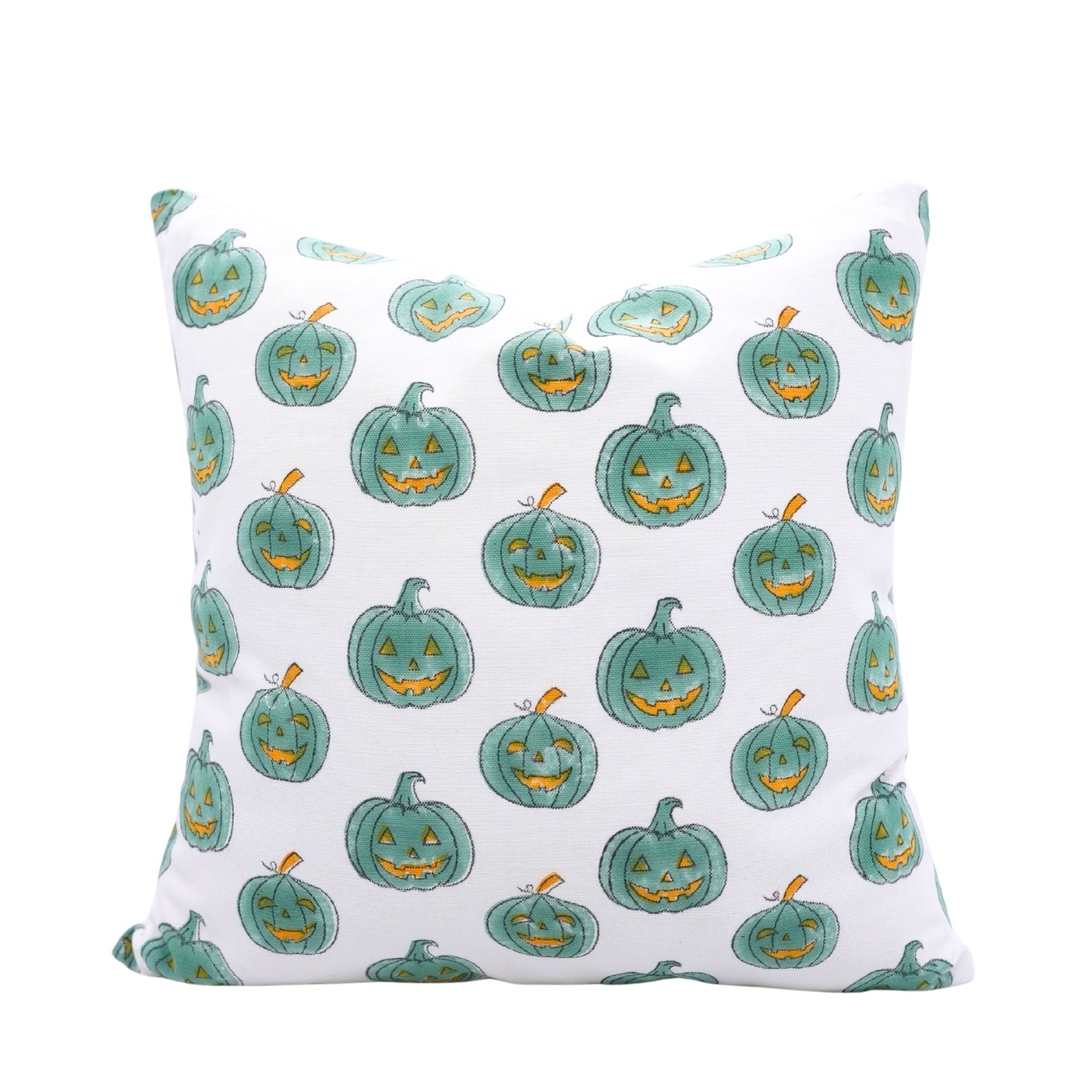 Pillow with teal jack-o'-lantern pattern on a white background