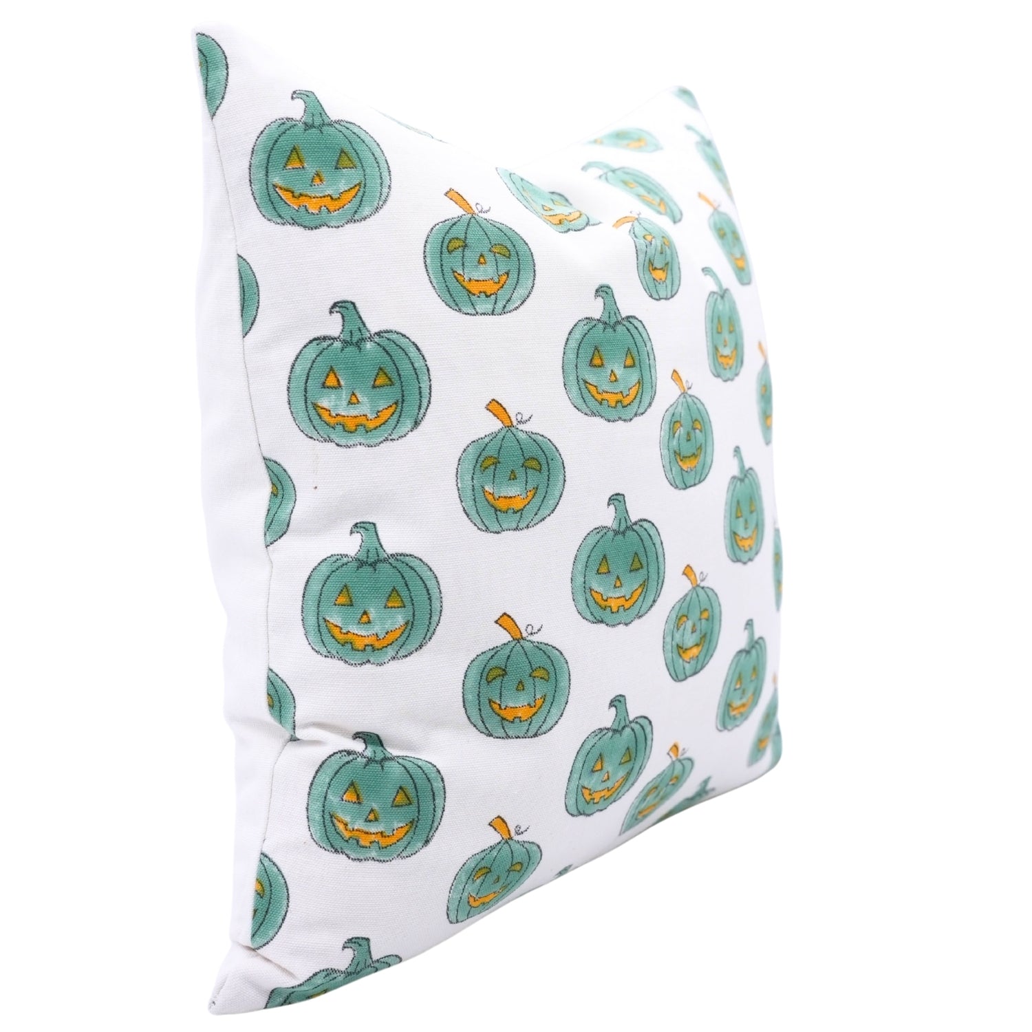 Pillow with green jack-o'-lantern pattern on a white background