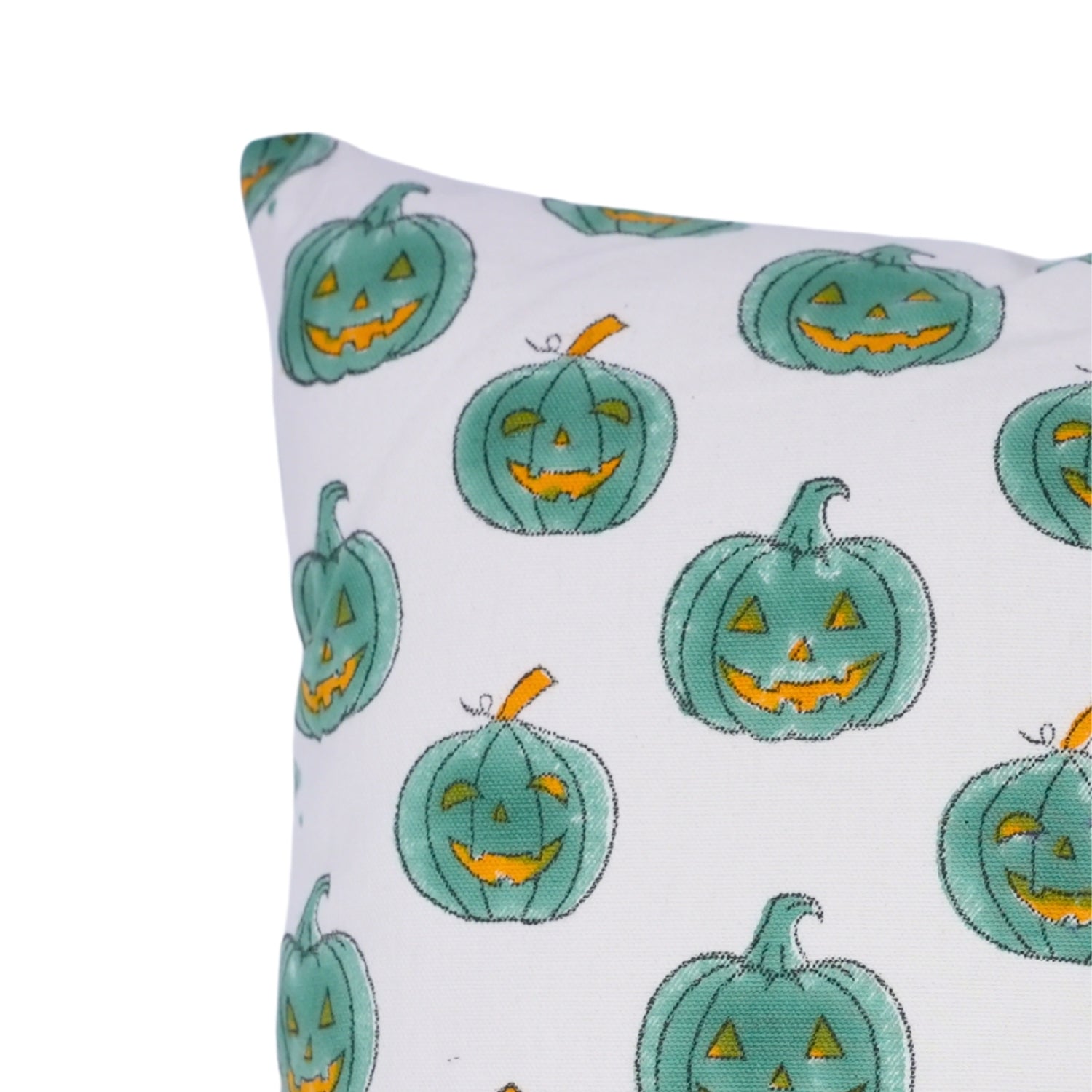 Pillow with teal jack-o'-lanterns on a white background
