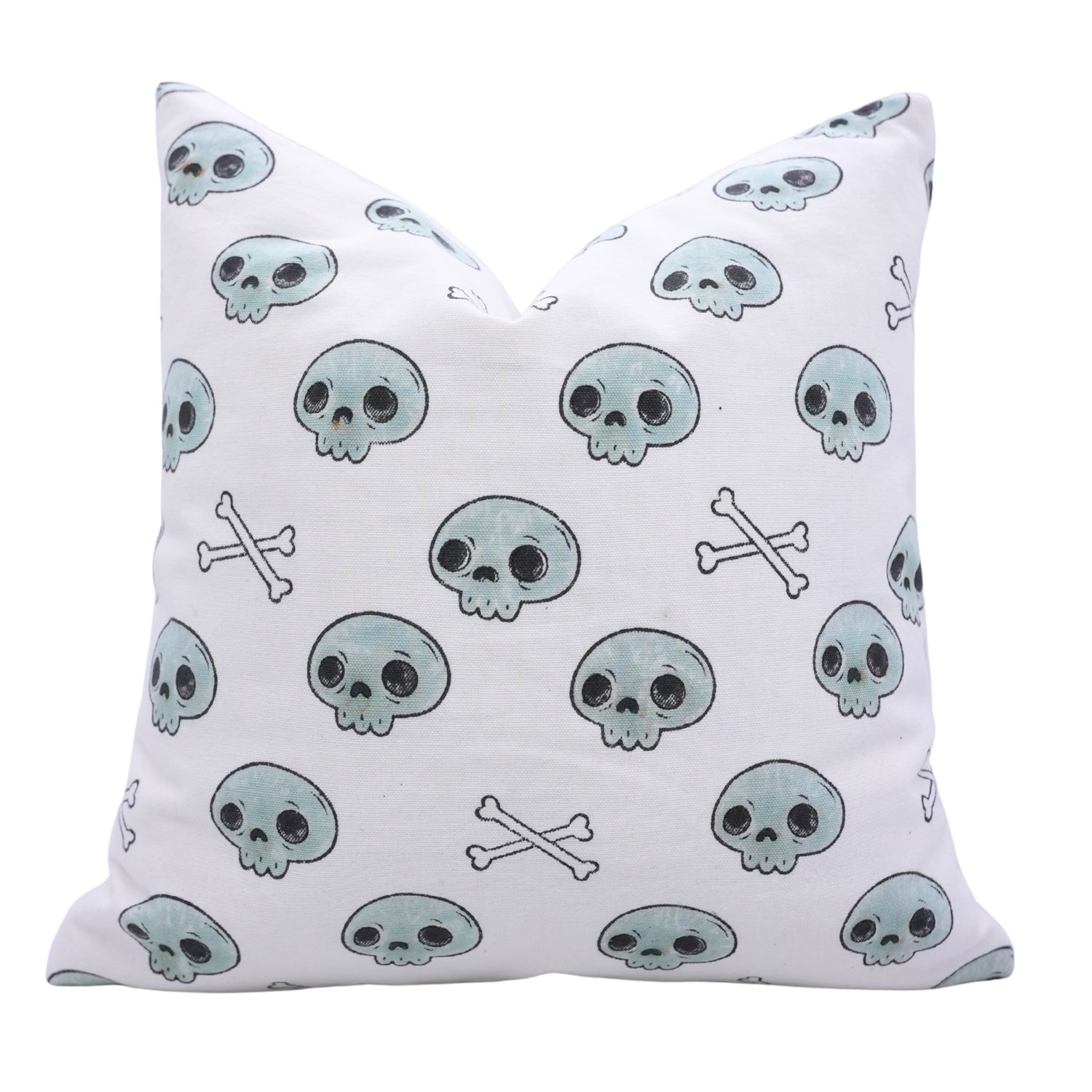 Pillow with skull and crossbones pattern on a white background