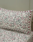Floral patterned pillow and bedspread that are Hand block printed cotton bedsheet with floral design and matching pillow covers.