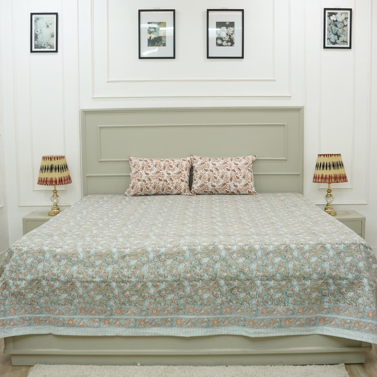 Reimagine your bedroom with this soft cotton bedsheet set, printed with elegant floral patterns using wooden blocks. This artisan creation delivers the perfect blend of comfort and visual delight.