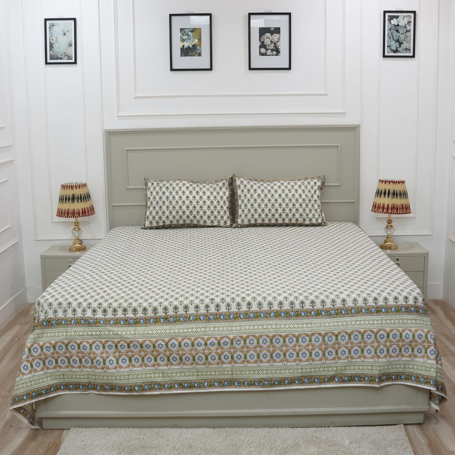 The delicate charm of block printing shines in this cotton bedsheet. Its floral design and pillow covers evoke rustic elegance, perfect for cozy homes with a handmade heart.