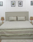 The delicate charm of block printing shines in this cotton bedsheet. Its floral design and pillow covers evoke rustic elegance, perfect for cozy homes with a handmade heart.