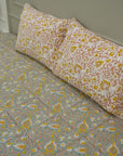 This block printed cotton bedsheet set adds timeless elegance to your room. Handmade with floral motifs, it reflects sustainable artistry while offering everyday comfort with a boho feel.