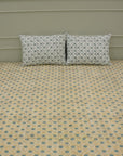 Discover the richness of Indian craftsmanship with this handmade cotton bedsheet and pillow cover. Wooden blocks imprint delicate floral patterns, creating a rustic yet elegant aesthetic. A beautiful blend of heritage and comfort for any space.