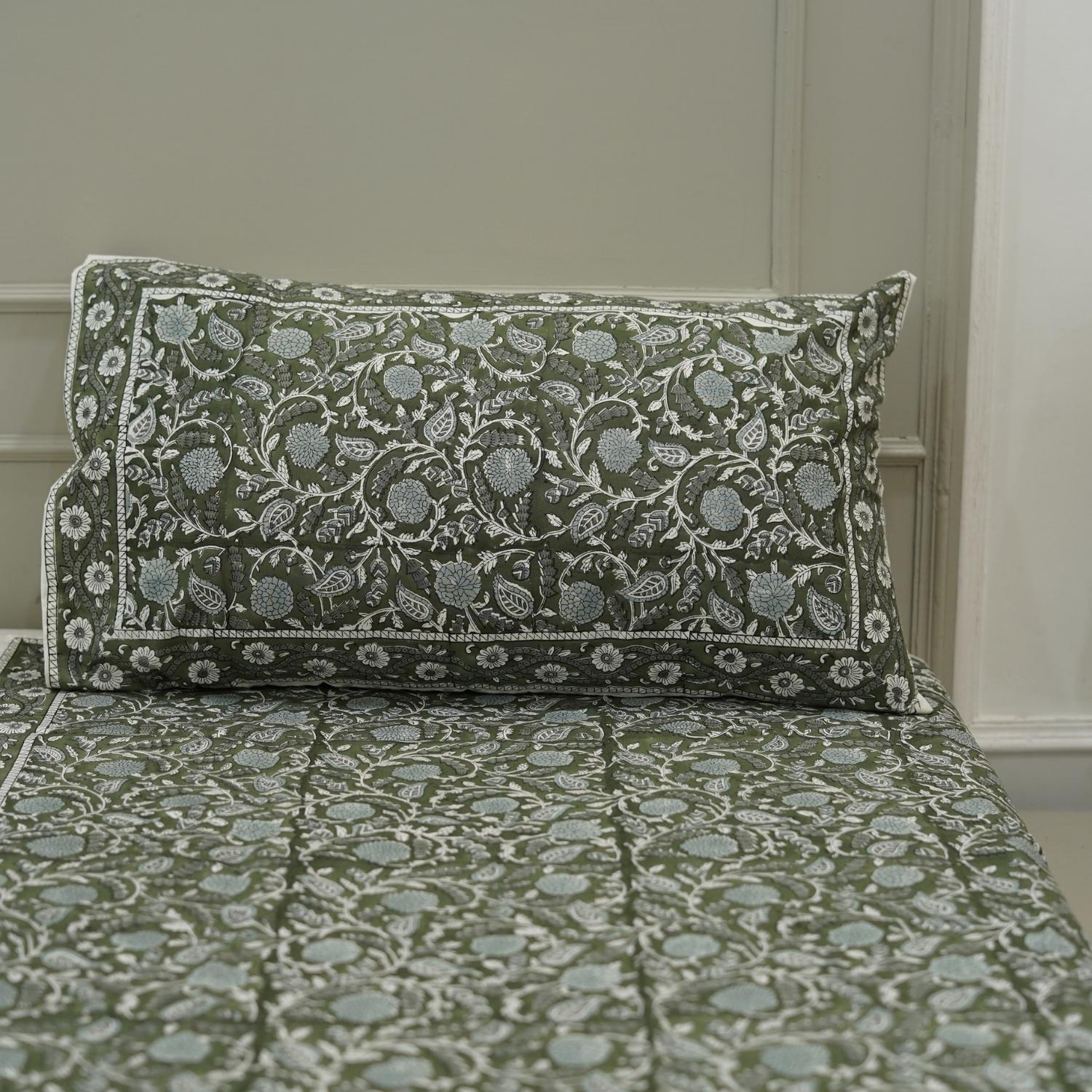 This floral hand block printed cotton bedsheet is a celebration of artisan skill. Each print is hand-stamped with care, making it a functional piece of art for your home.