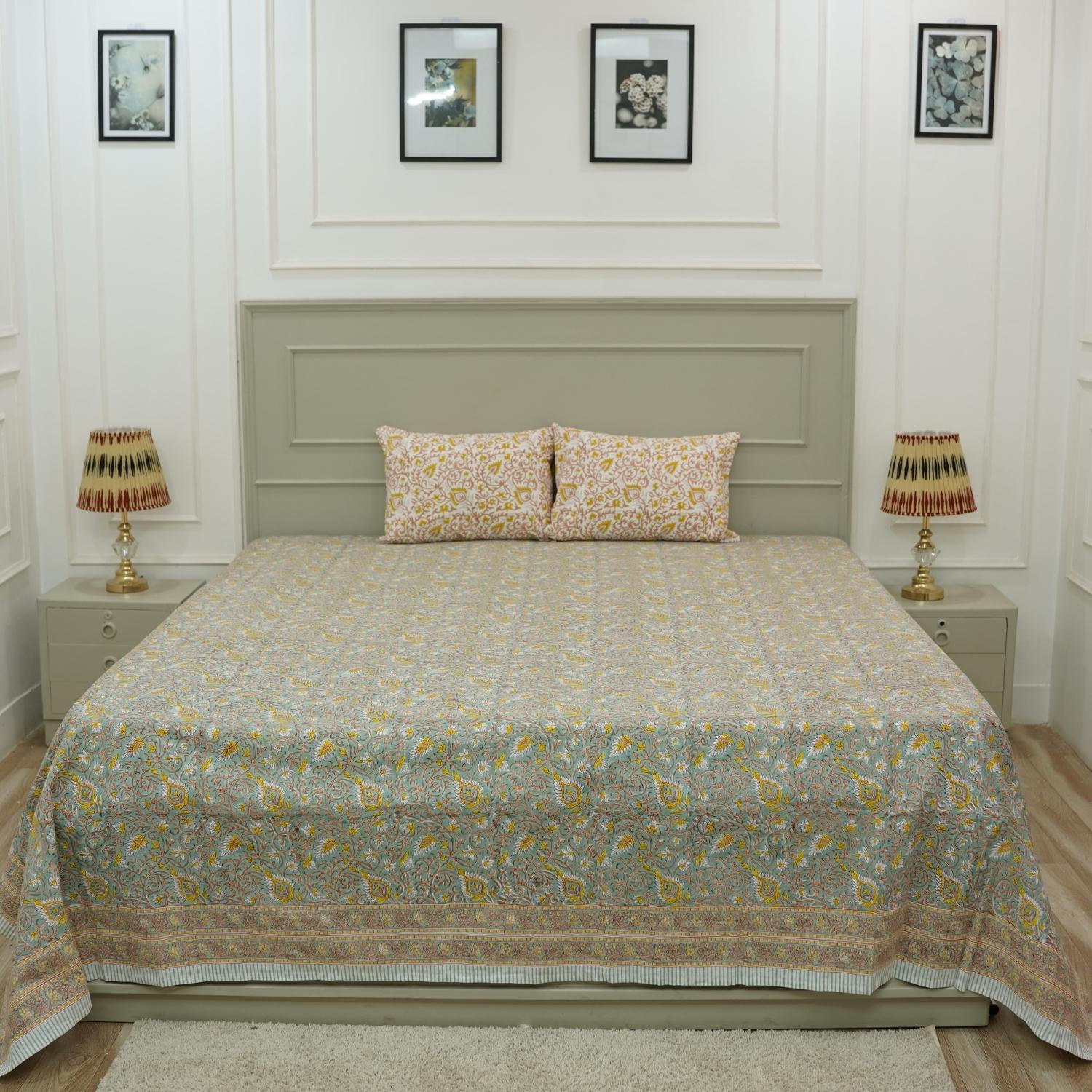 Rich in tradition and texture, this cotton bedsheet features detailed floral block prints. Accompanied by coordinating pillow covers, it reflects the charm of artisan-crafted bed linen made with care and heritage.