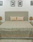 Rich in tradition and texture, this cotton bedsheet features detailed floral block prints. Accompanied by coordinating pillow covers, it reflects the charm of artisan-crafted bed linen made with care and heritage.