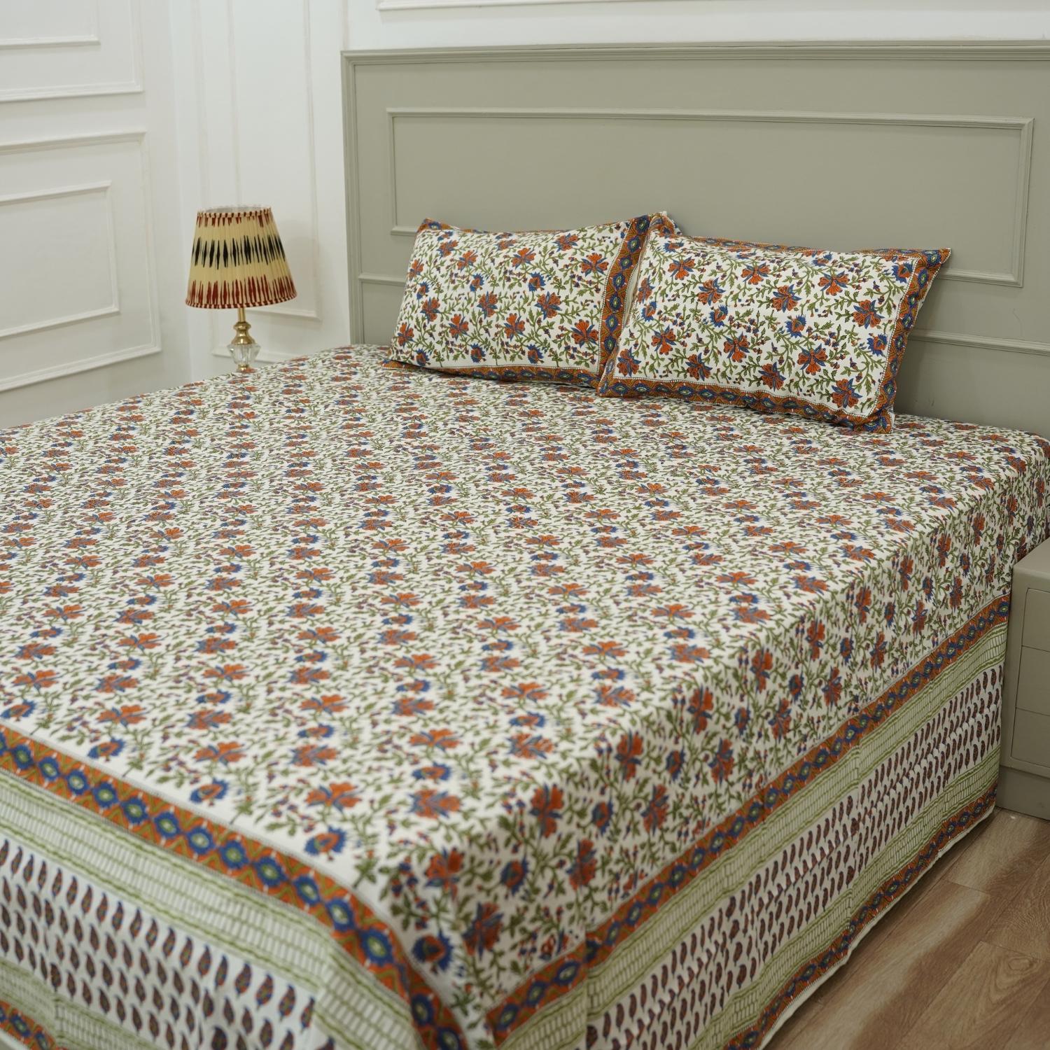 Experience timeless elegance with our handmade cotton bedsheet and pillow cover set, featuring intricate hand block printed floral motifs. Crafted by artisans, this soft cotton linen brings bohemian charm and warmth to any farmhouse or modern bedroom.