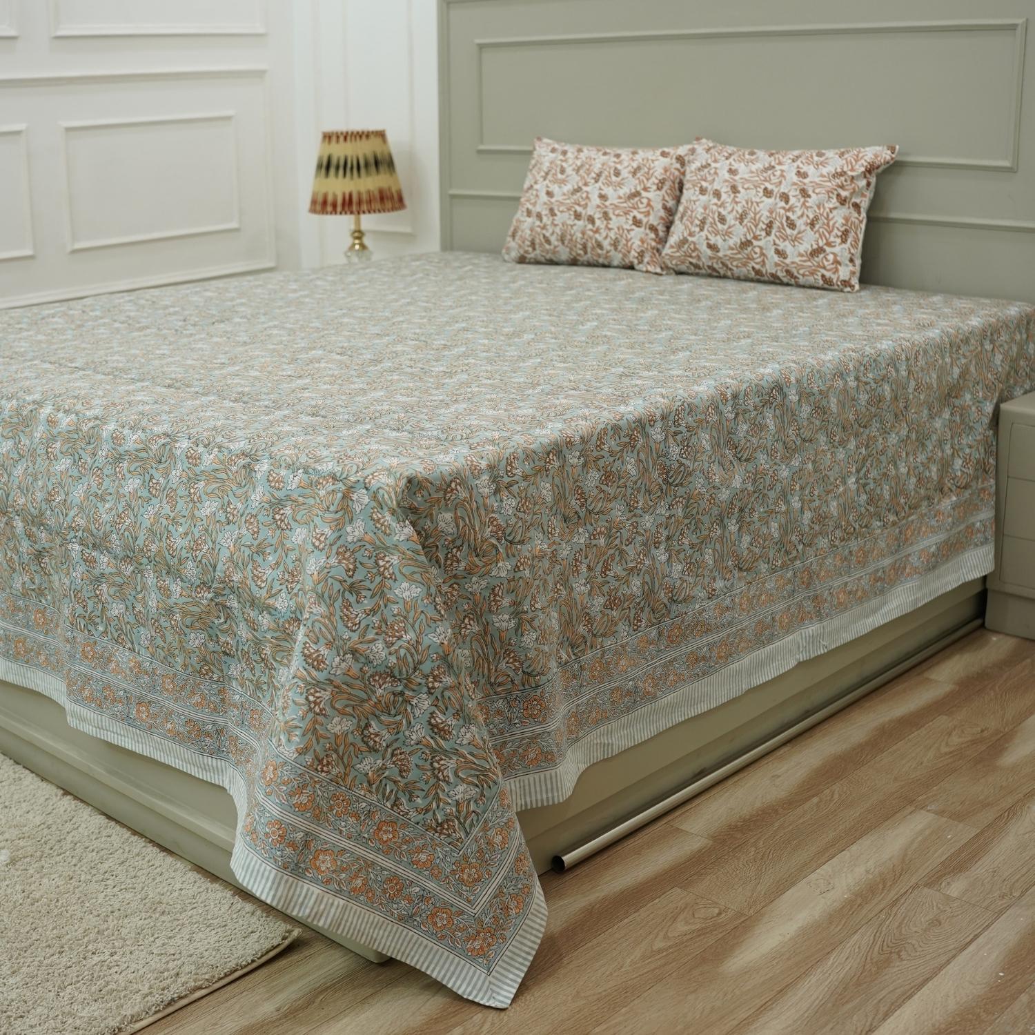 Immerse yourself in handcrafted beauty with this floral block printed bedsheet. Made of soft cotton and paired with matching pillow covers, it’s a thoughtful blend of traditional skill and modern living.