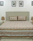 Rich in tradition and texture, this cotton bedsheet features detailed floral block prints. Accompanied by coordinating pillow covers, it reflects the charm of artisan-crafted bed linen made with care and heritage.