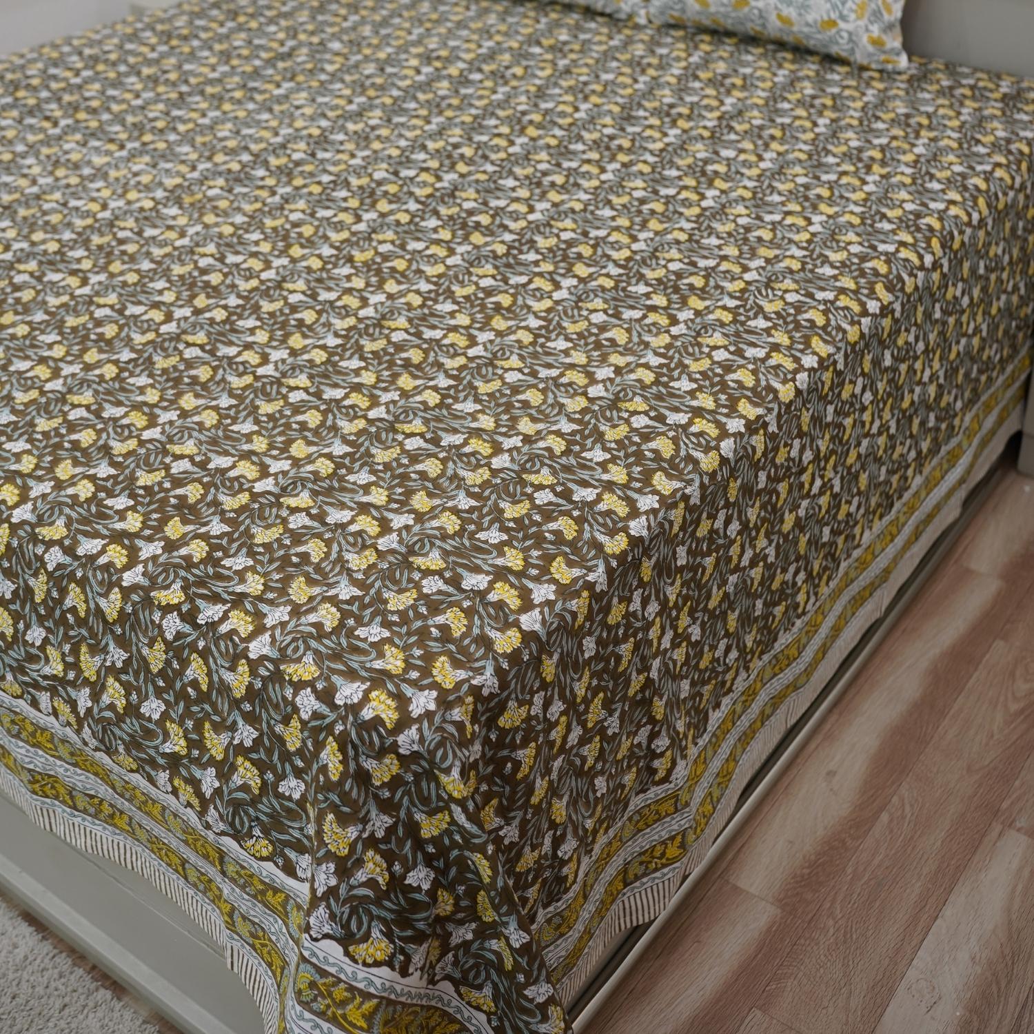 Immerse yourself in handcrafted beauty with this floral block printed bedsheet. Made of soft cotton and paired with matching pillow covers, it’s a thoughtful blend of traditional skill and modern living.