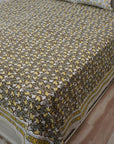 Immerse yourself in handcrafted beauty with this floral block printed bedsheet. Made of soft cotton and paired with matching pillow covers, it’s a thoughtful blend of traditional skill and modern living.