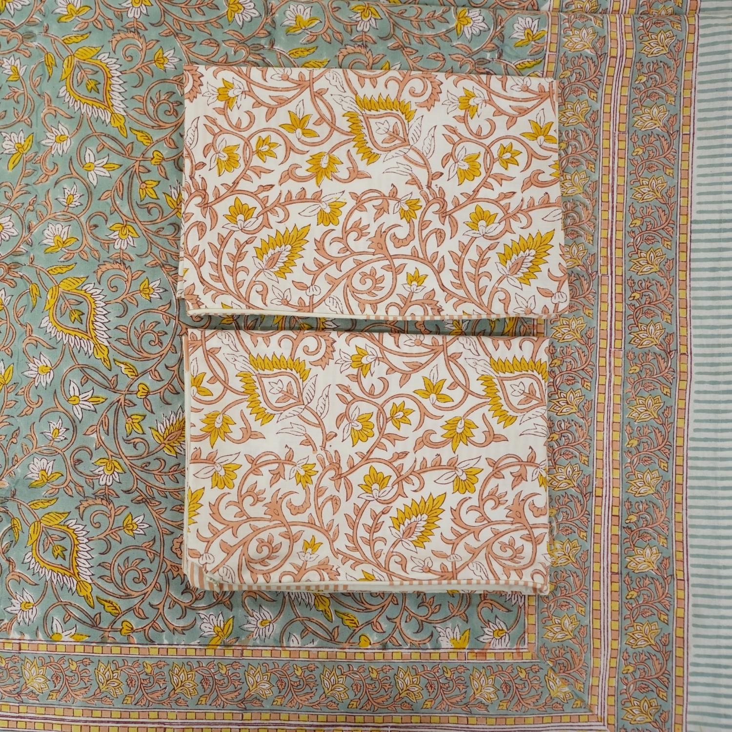 A celebration of Indian artistry, this bedsheet and pillow cover set is hand block printed on breathable cotton. The floral patterns bring warmth and elegance to your decor with every touch.