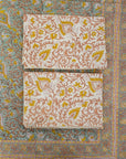 A celebration of Indian artistry, this bedsheet and pillow cover set is hand block printed on breathable cotton. The floral patterns bring warmth and elegance to your decor with every touch.