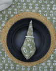Block printed green napkin beautifully set on a dining table