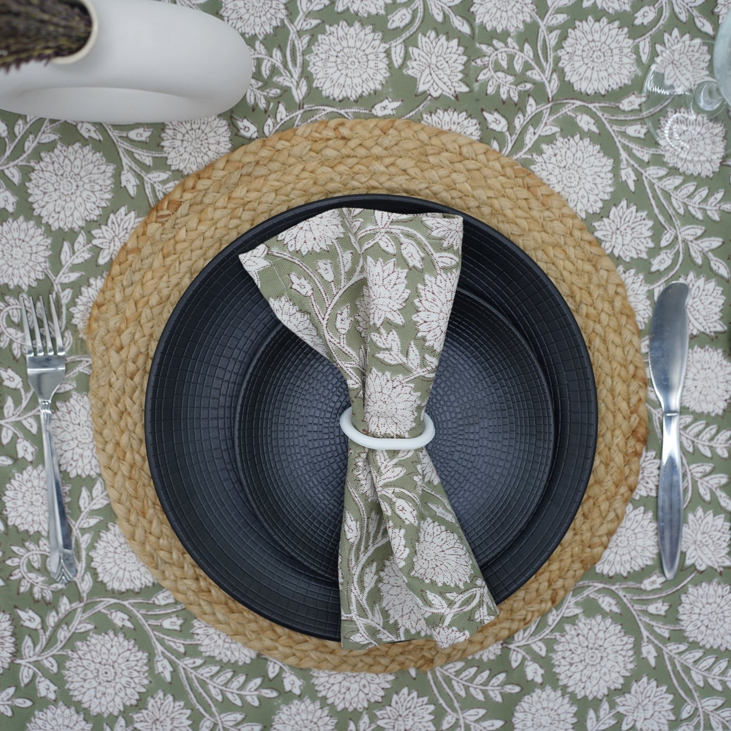 Fresh green napkin neatly folded on a dining table