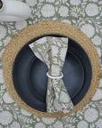 Fresh green napkin neatly folded on a dining table