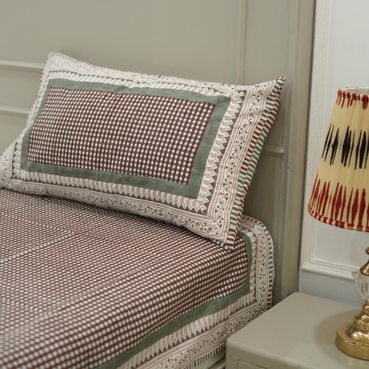 Sleep in comfort wrapped in art. This hand block printed cotton bedsheet set features natural florals, each pressed with wooden blocks and crafted with love by skilled artisans.