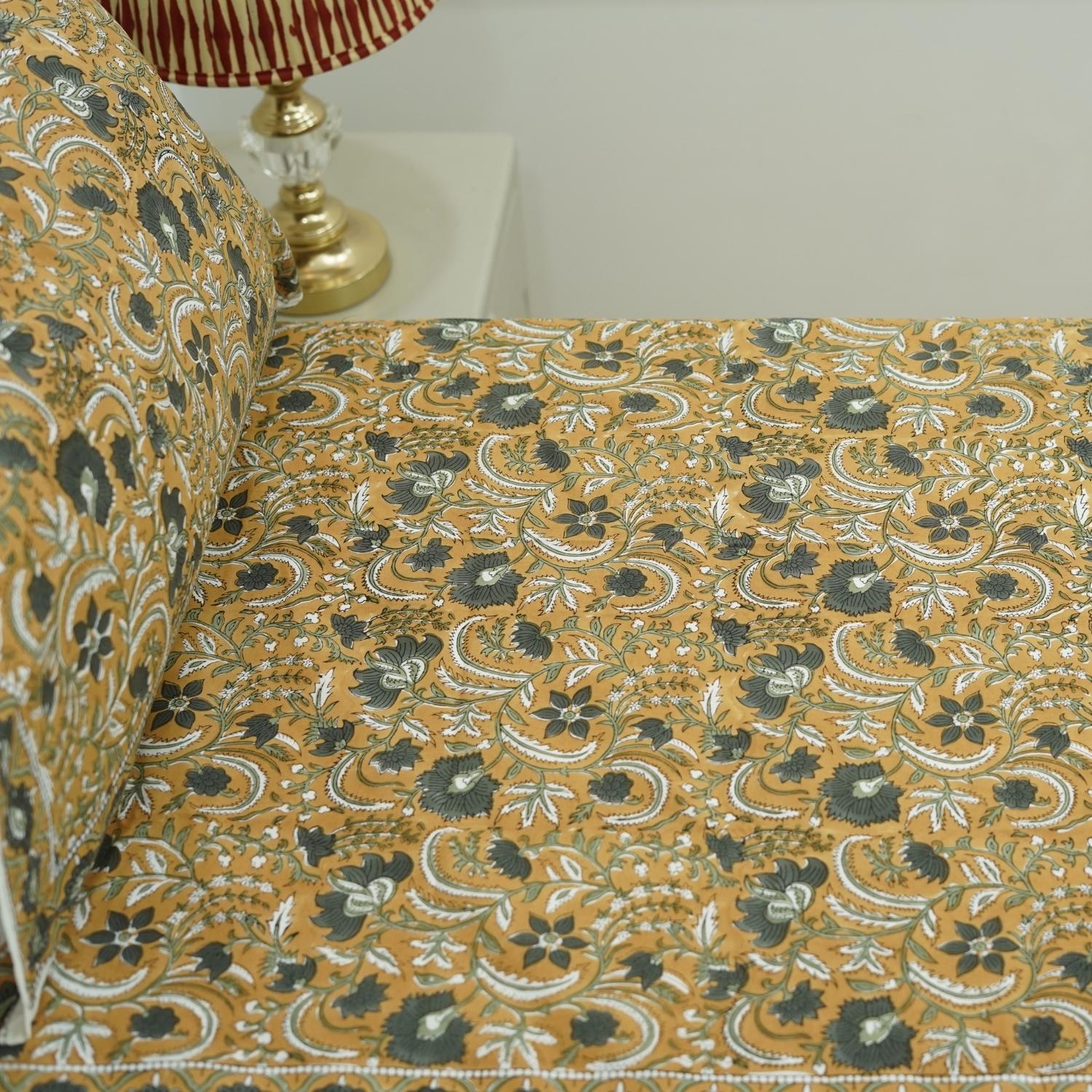 This boho-style cotton bedsheet features elegant floral block prints created using time-honored wooden block techniques. A soft, inviting piece to refresh your bedroom style.