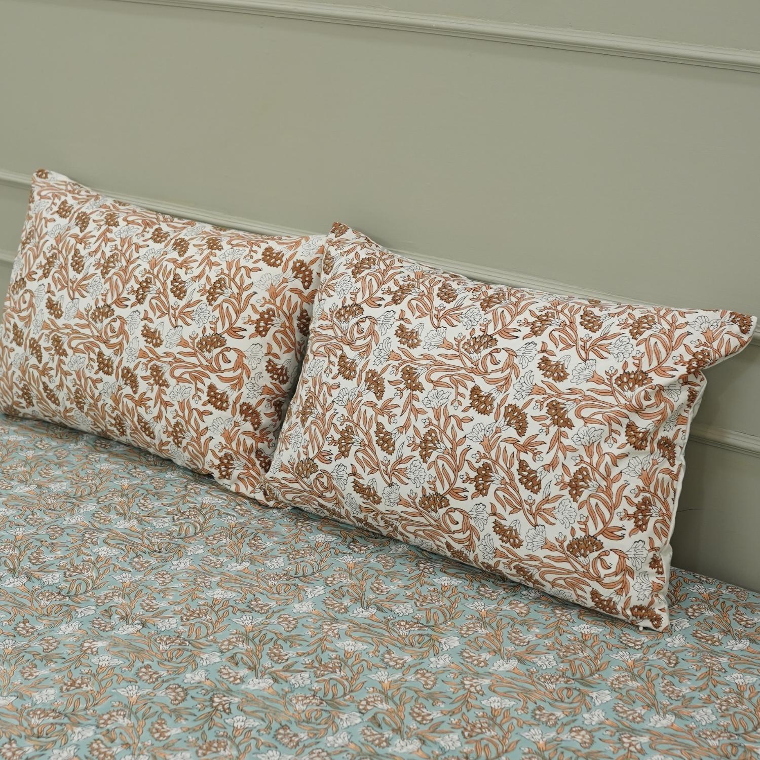 Each motif on this cotton bedsheet is hand block printed using wooden blocks, ensuring every set is one-of-a-kind. Its floral patterns and soft touch make it ideal for dreamy, earthy interiors.