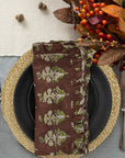 Elephant block print frill napkin on a cozy table setting.