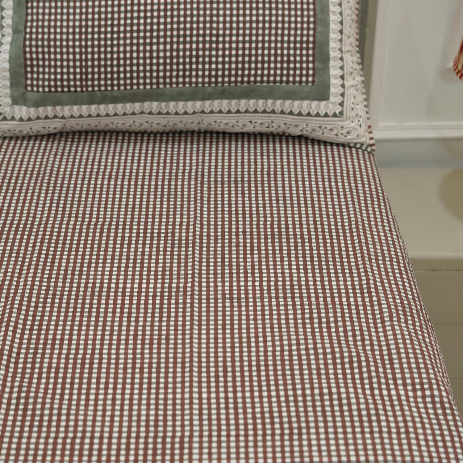 This cotton bedsheet and pillow set tells a story of handmade tradition. Featuring hand block floral prints, it’s a celebration of nature, comfort, and heritage in your home.