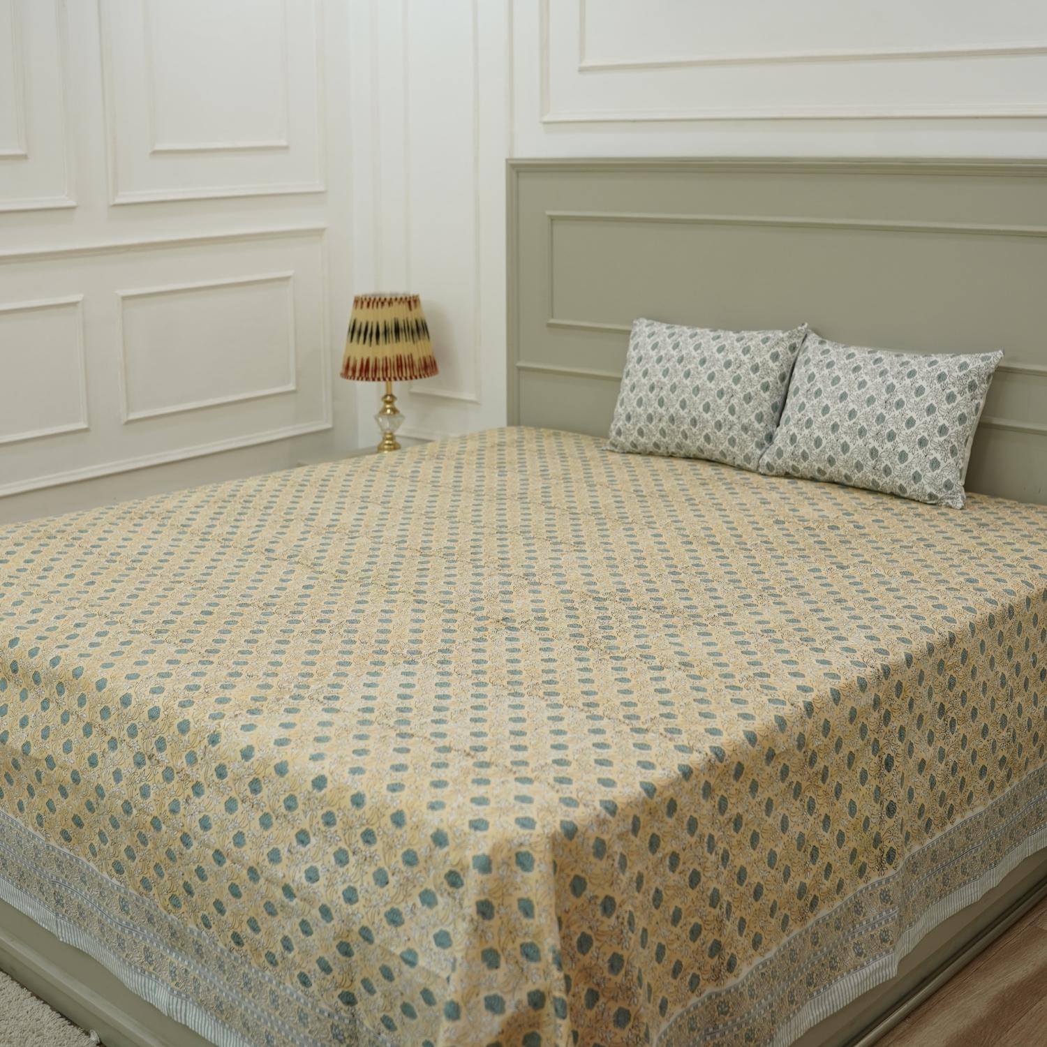 Experience timeless elegance with our handmade cotton bedsheet and pillow cover set, featuring intricate hand block printed floral motifs. Crafted by artisans, this soft cotton linen brings bohemian charm and warmth to any farmhouse or modern bedroom.