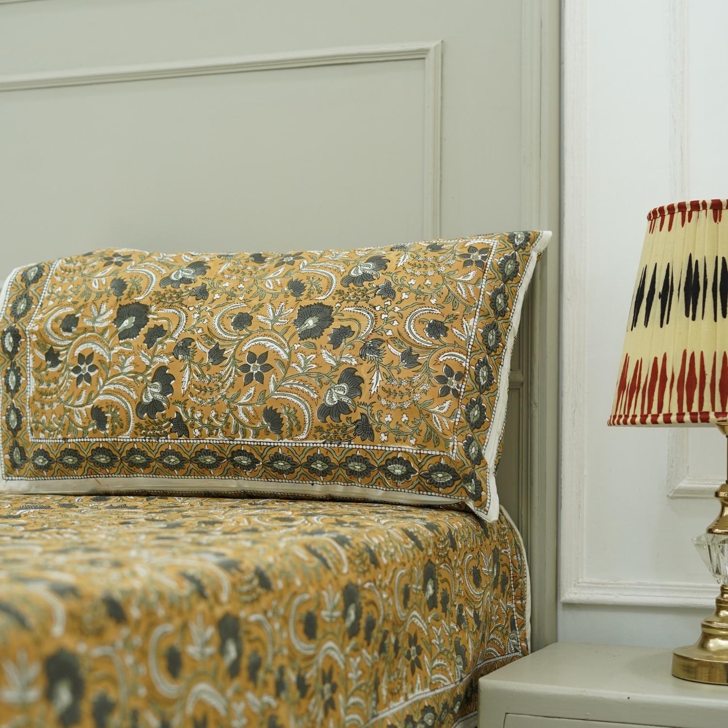 Rooted in tradition, this hand block printed cotton bedding set brings artisan charm to your home. Its floral motifs and soft fabric offer a warm, handcrafted experience.