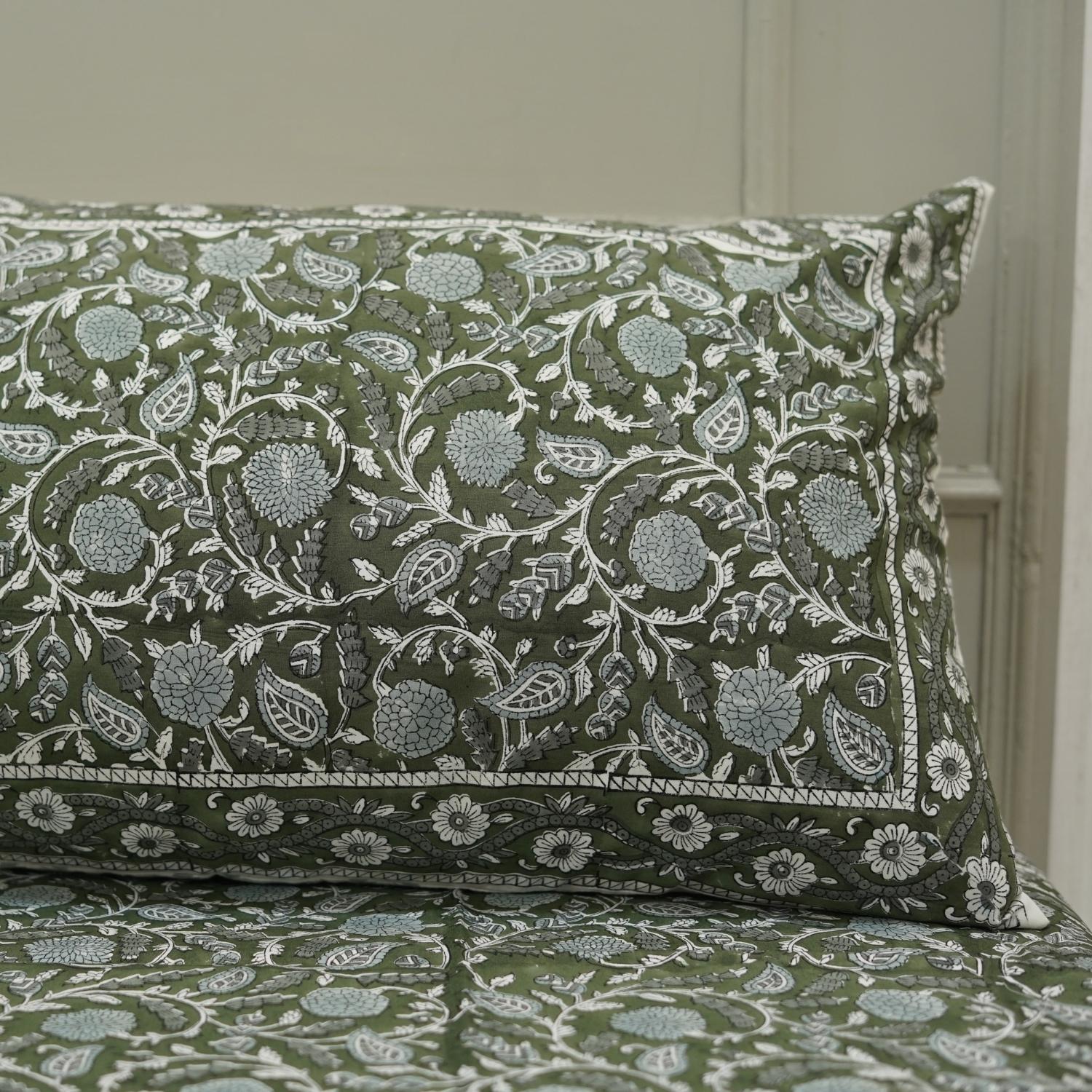 The delicate charm of block printing shines in this cotton bedsheet. Its floral design and pillow covers evoke rustic elegance, perfect for cozy homes with a handmade heart.