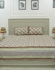 This hand block printed cotton bedsheet and pillow set is a statement in sustainable living. Natural dyes and floral designs create a calming aesthetic, offering handmade luxury with a touch of earthy elegance.