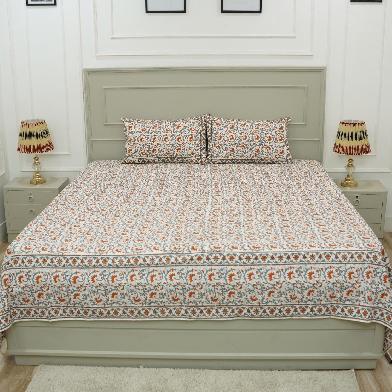 Reimagine your bedroom with this soft cotton bedsheet set, printed with elegant floral patterns using wooden blocks. This artisan creation delivers the perfect blend of comfort and visual delight.
