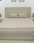 Reimagine your bedroom with this soft cotton bedsheet set, printed with elegant floral patterns using wooden blocks. This artisan creation delivers the perfect blend of comfort and visual delight.