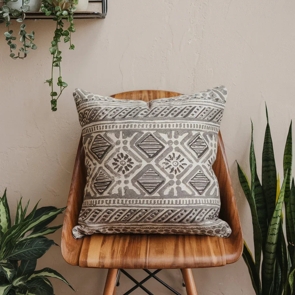 An image of an ARADHANA block print throw pillow with a geometric pattern