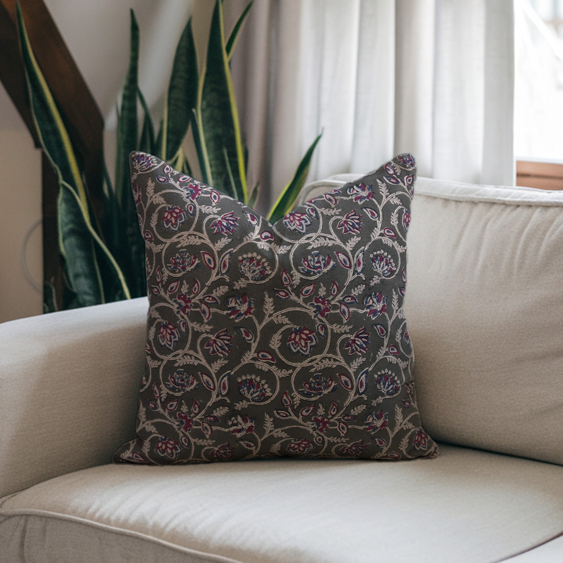 Decorative black pillow with floral pattern