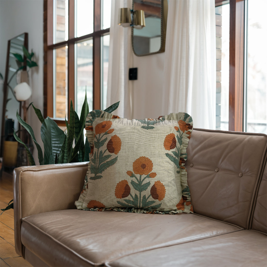 Elegant frill linen pillow covers with green leaf patterns and ruffled edges on a bright white background.