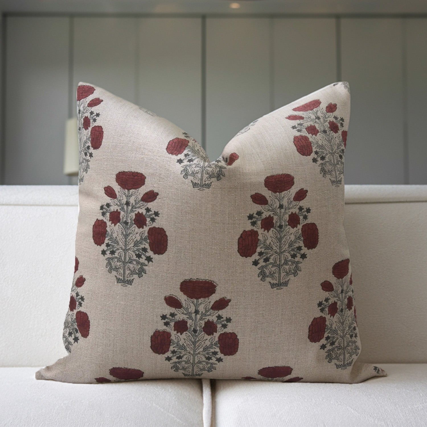 Decorative pillow with floral pattern on a white sofa