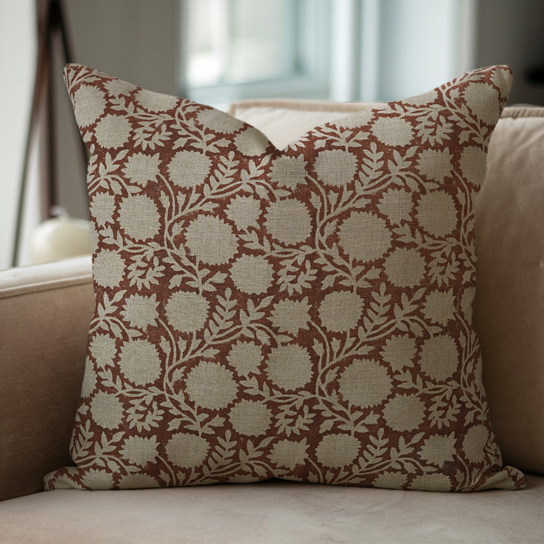 Decorative brown pillow with floral pattern 