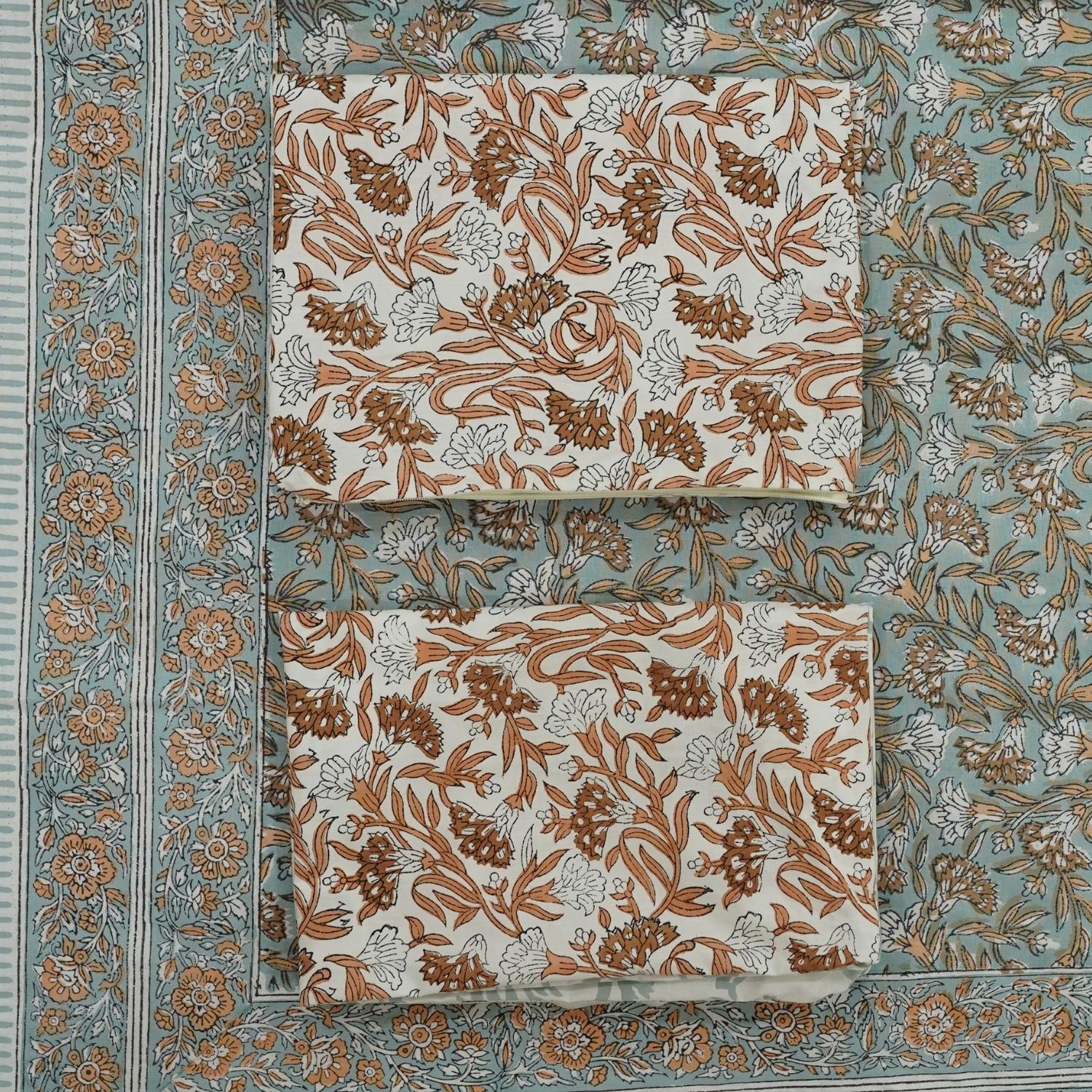 Our artisan-crafted cotton bedding features hand block floral prints that elevate your room&#39;s ambiance. Paired with pillow covers, this set is a tribute to timeless technique and sustainable charm.