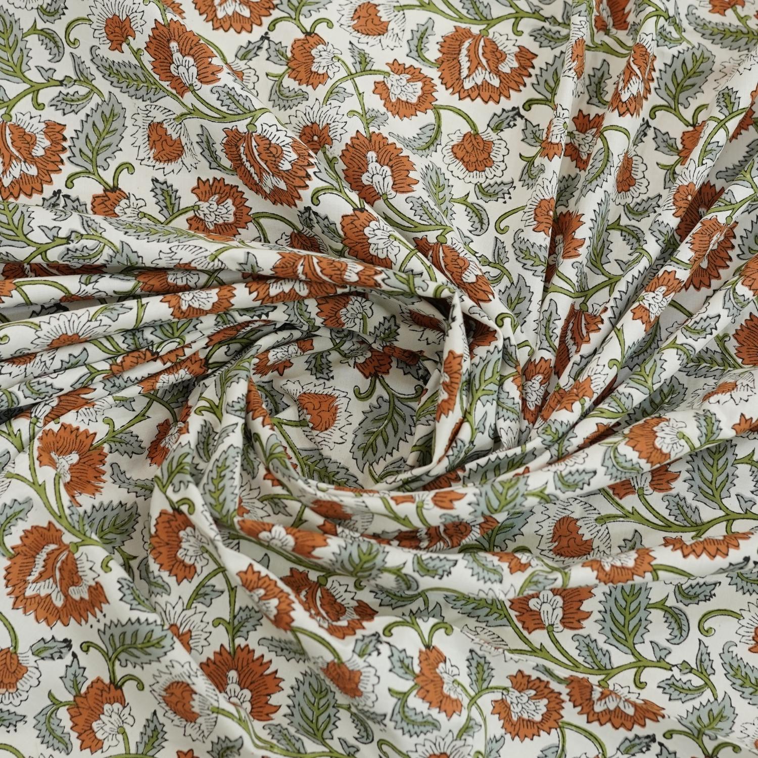 This handmade cotton bedsheet set brings together fine craftsmanship and natural design. Floral prints, block stamped on breathable cotton, transform your bed into a canvas of boho-chic charm.