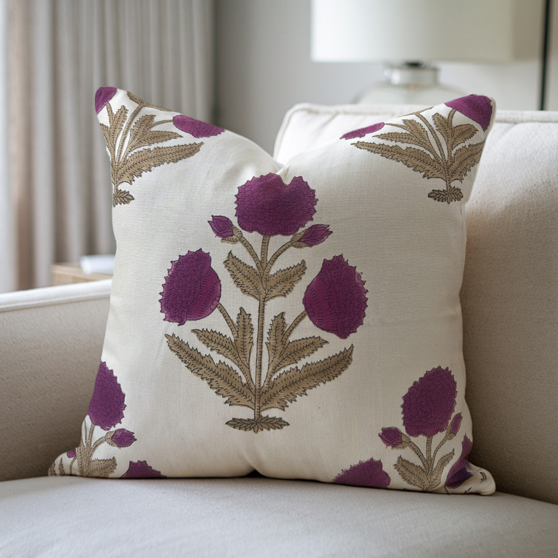 Decorative pillow with floral pattern on a beige sofa
