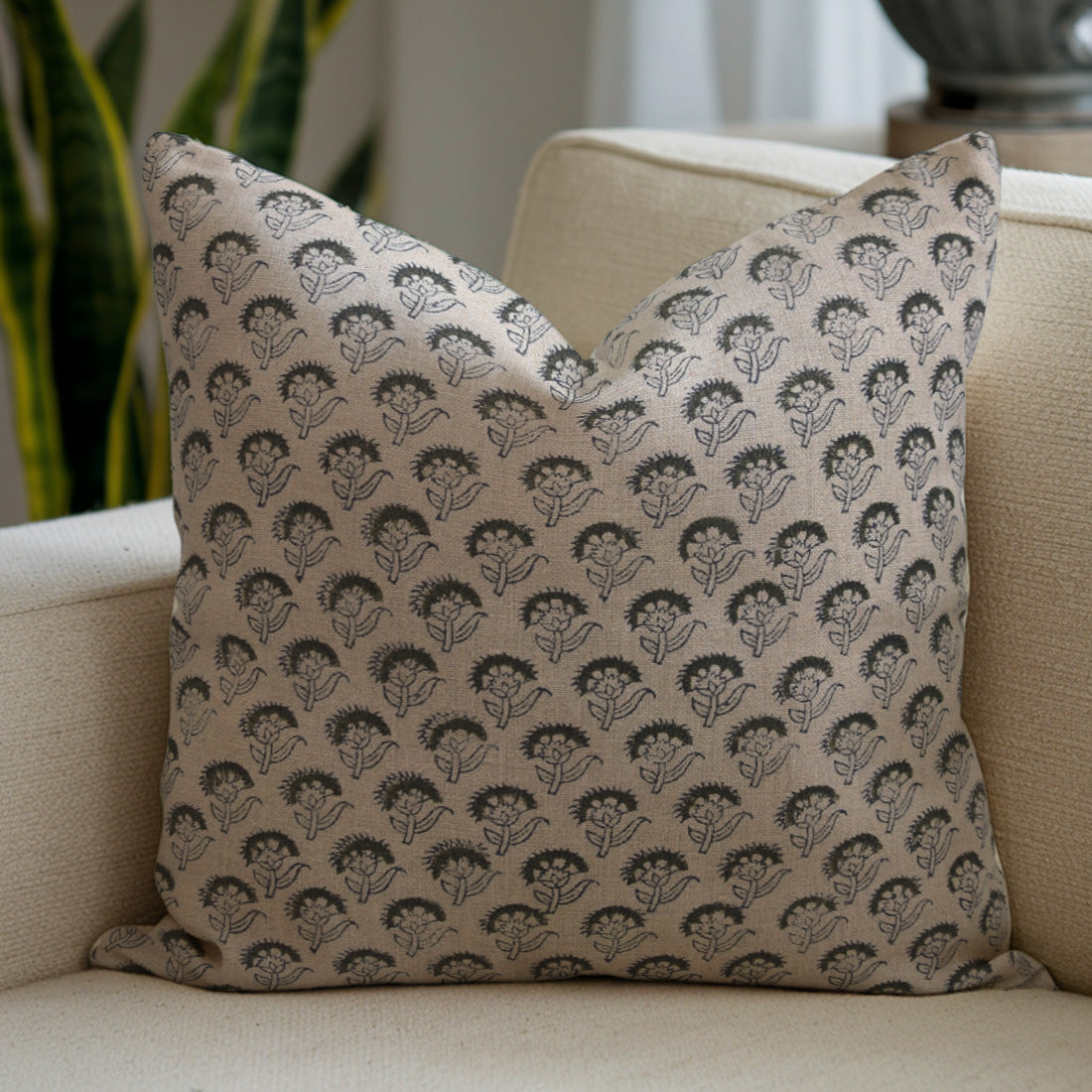 Decorative pillow with a hedgehog pattern on a beige sofa