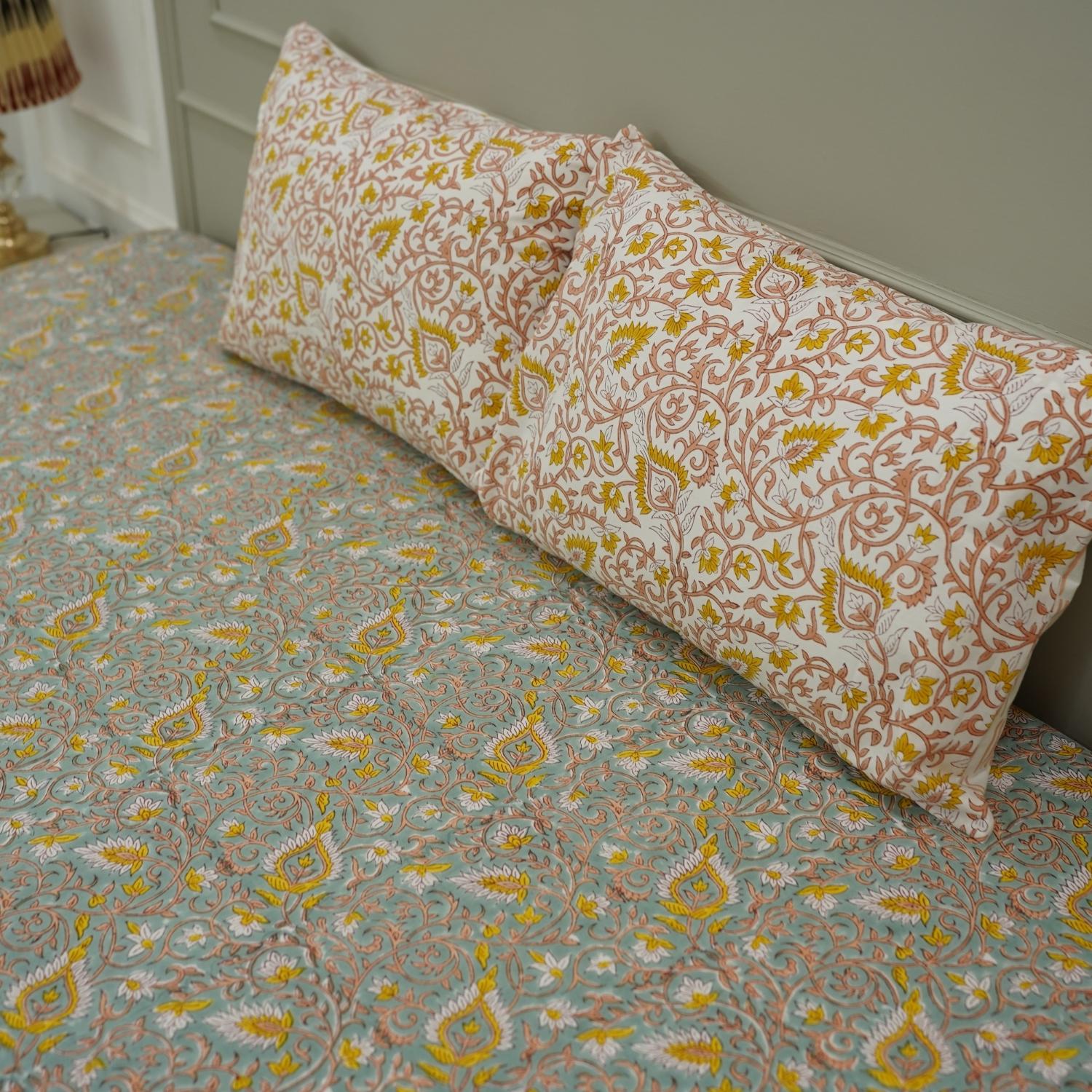 This block printed cotton bedsheet set adds timeless elegance to your room. Handmade with floral motifs, it reflects sustainable artistry while offering everyday comfort with a boho feel.